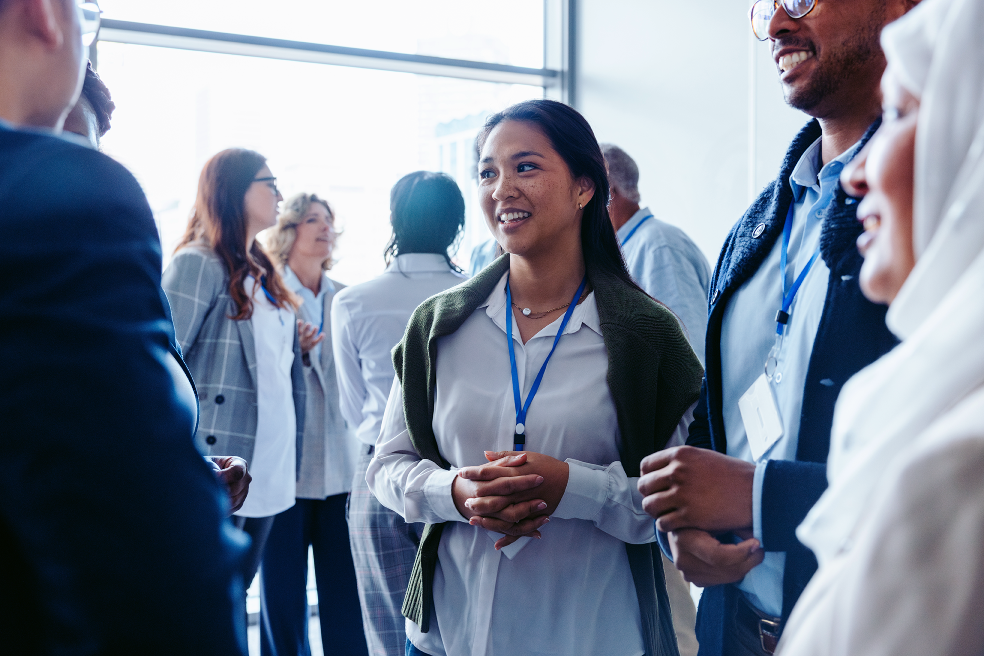 Conference attendees networking and conversing at a professional event