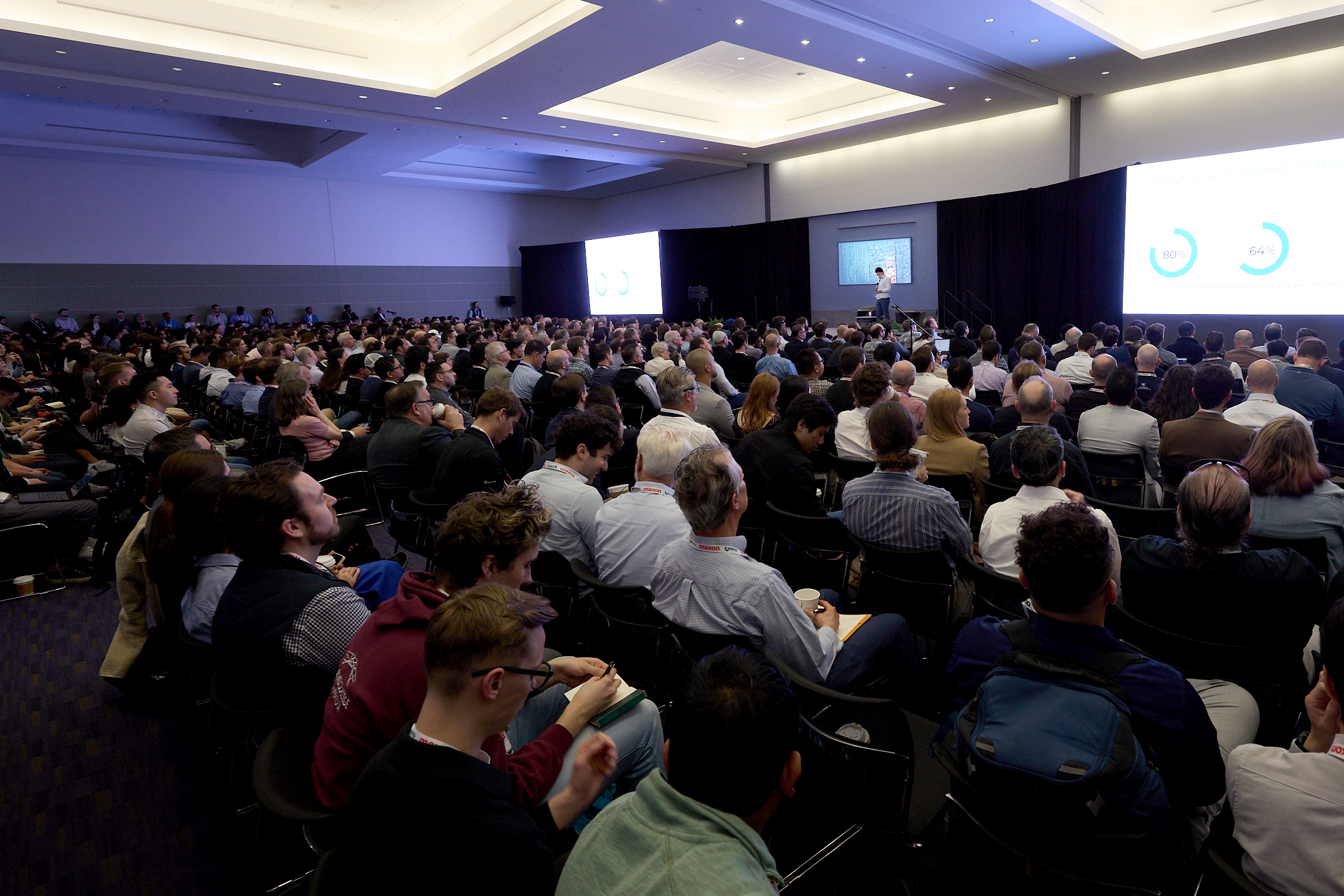 Packed conference keynote session with hundreds of attendees